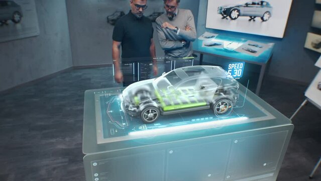 Two development engineers. Testing the speed performance of a cutting edge eco-friendly electric car with sustainable standards using an advanced, holographic augmented reality desk.