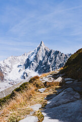 high alpine peak with autumn colors in foreground