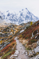 alpine landscape with trail in autumn colors