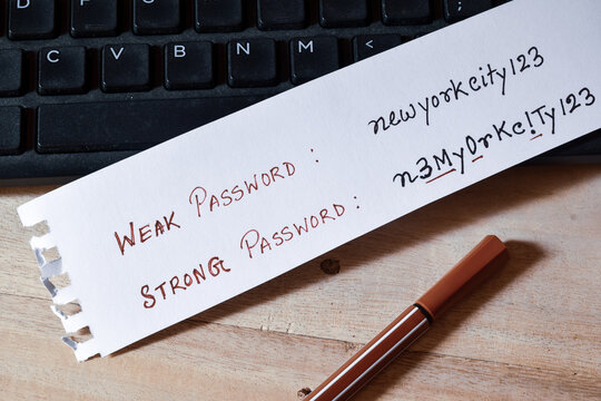 Weak and strong password setting hints on a piece of paper on office desk. Close-up, selective focus.