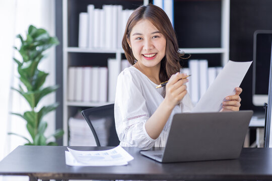 Business Documents, Auditor businesswoman checking searching document legal prepare paperwork or report for analysis TAX,Asian woman accountant Documents data contract partner deal in workplace office