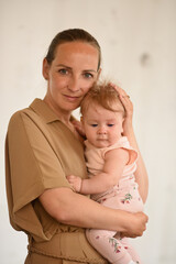 Mom holds the baby in her arms