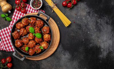 Traditional spicy meatballs in sweet and sour tomato sauce. Restaurant menu, dieting, cookbook recipe top view