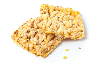 Macro photo of  whole grain crusty bread. Snacks made of air wheat or corn on a white background.
