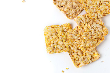 Whole grain crusty bread. Snacks made of air wheat or air grain on a white background