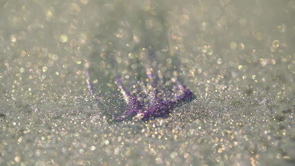 Close up view of shiny and purple eye shadow with shimmer