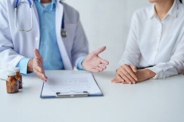 Doctor who records a patient's detailed information or medication history is evaluating medications and vaccines for the intended treatment. or if there are any side effects.
