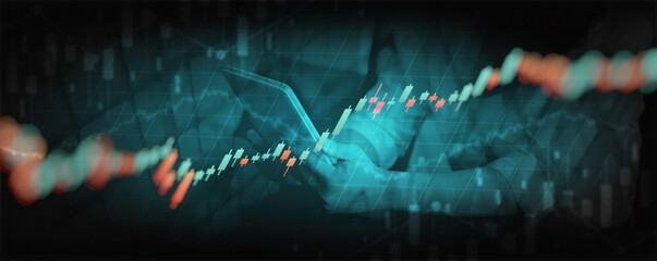 Double exposure of Financial chart with line graph in stock market and business man use tablet background
