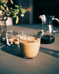 Milky coffee in golden window light.