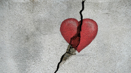 red heart on a cracked wall