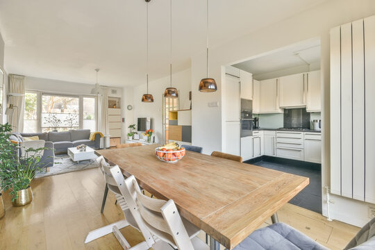 Spacious modern apartment with cozy sofa dining table and kitchen