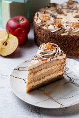 Seasonal birthday cake with sliced apples and a whole cake on background, menu studio shot