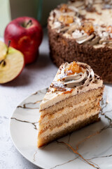 Seasonal birthday cake with sliced apples and a whole cake on background, menu studio shot