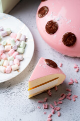 Flawless valentine cake with mirror glazing on minimalist grey background with soft lighs, studio shot