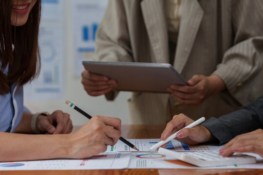 Fund managers team consultation and discuss about analysis Investment stock market at office