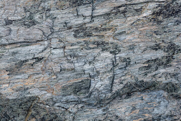 the natural stone wall background or texture