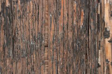 Fototapeta na wymiar Old, worn plywood wall with worn black paint