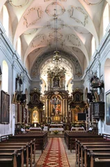 Poster Main nave and presbytery of Holy Mary of Mirow sanctuary within Franciscan monastery in historic old town quarter of Pinczow in Poland © Art Media Factory