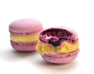Delicious macaroons lie on a white tray.