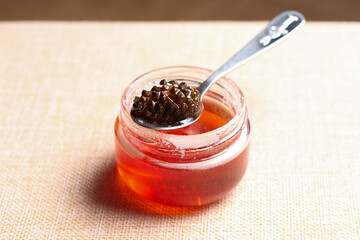 Pine cone jam. Small cones in sweet syrup close-up. Small pine cones in sugar syrup.