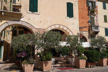 Fototapeta na wymiar Verona, Italy - July 13, 2022 - quiet corners of the historic city centre on a sunny day