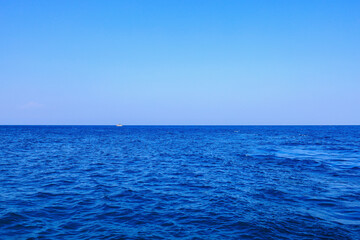 View of the open sea from the yacht. Background with selective focus
