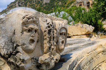 Obraz premium Ancient sculptures in the ruins of the acropolis in Demre in Turkey in the province of Antalya, the ancient city of Myra
