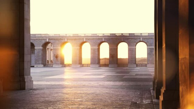 Detail of weapons patio arches in Madrid Royal Palace at sunset