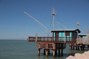 Italy, Marche, Fano: Wooden constructions on the water, called Trabucchi.