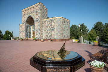 Sundial on the background of the Ulugbek Observatory Museum building. Samarkand