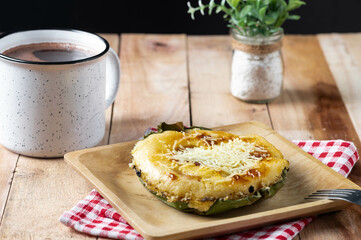 Bibingka commonly refers to a type of baked rice cake from the Philippines that is traditionally cooked in a terracotta oven lined with banana leaves and is usually eaten for breakfast or as merienda 