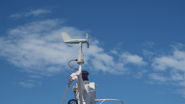 Wind vanes, wind sensor on the cargo ship mast. Details of a commercial ship boat bridge communication mast.