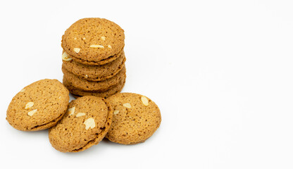 A group of brown cookies with white peanut or nut, danish cookie in christmas. Round bakery homemade isolated on white background with clipping path. biscuit put overlapping and horizontal with space