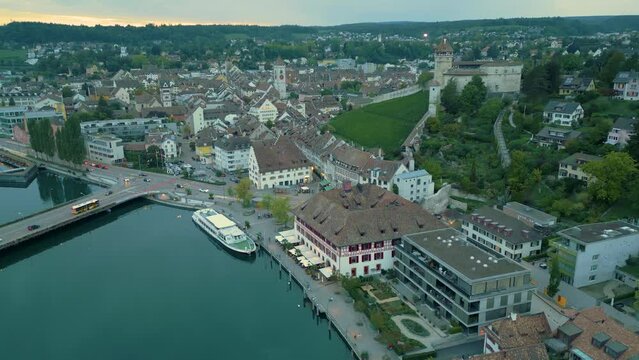 Revealing drone shot of Schaffhausen city centre Munot fortress