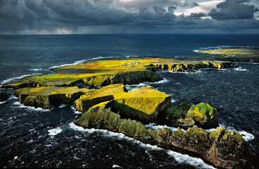 Tory Island, Co. Donegal, Ireland. Celtic Balor's Fort on flat top peninsula. Hut circles, defence ditch and rampart visible. © David Matthew Lyons