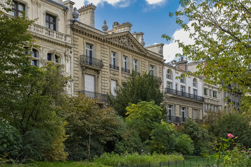 Paris, beautiful ancient building in the parc Monceau, public garden, in a luxury area
