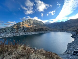 Artificial reservoir lake Lago di Lucendro or accumulation lake Lucendro in the Swiss alpine area of the St. Gotthard Pass (Gotthardpass), Airolo - Canton of Ticino (Tessin), Switzerland (Schweiz)