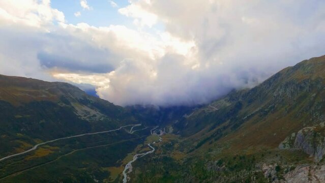 View at Goms valley, Rotten river and rolling clouds going from behind the mountain