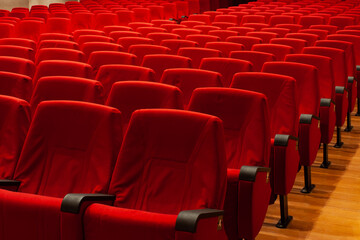 Fototapeta premium Red armchairs of a empty cinema