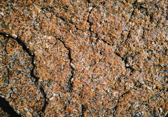 Rough dark red stone texture. Natural grunge background. Copy space.