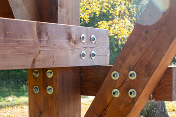 Wooden beams joint with metal screws