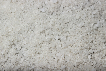 Coarse rock salt in full screen as a background for the image. Rock salt texture