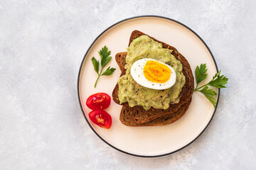 Healhy Breakfast Toast With Avocado, Boiled Egg On Plate