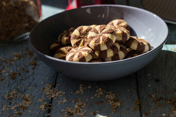 Sweet chocolate brownies on rustic wooden table with flakes