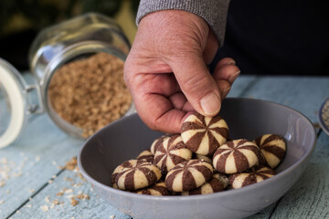 Woman hand holding a sweet chocolate brownies