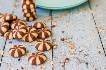 Fototapeta na wymiar Sweet chocolate brownies on rustic wooden table with flakes