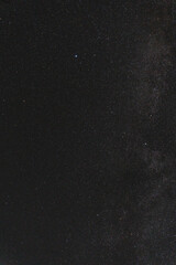 Very beautiful starry sky at night, the milky way, the stars are big and bright. Vertical photo.