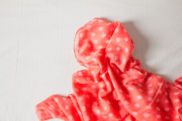 Fashion look with polka dot pattern scarf. Feminine fashion concept.