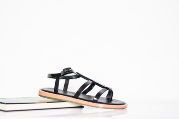 Trendy female sandals on white background. Aesthetic fashion accessory. 