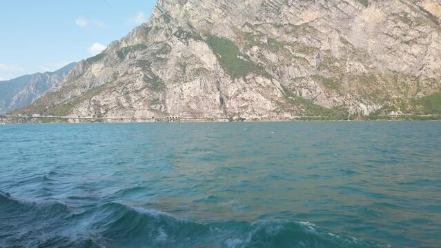 Sailing on Garda lake in Italy in summer sunshine 4K stock video 2